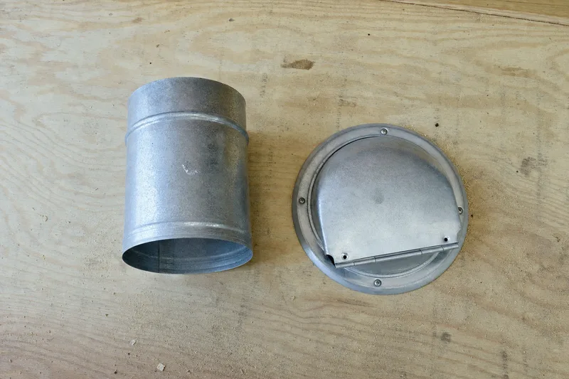 Section of rigid metal dryer duct and a termination hood, illustrating the parts involved in rerouting a vent that improperly ends in the attic